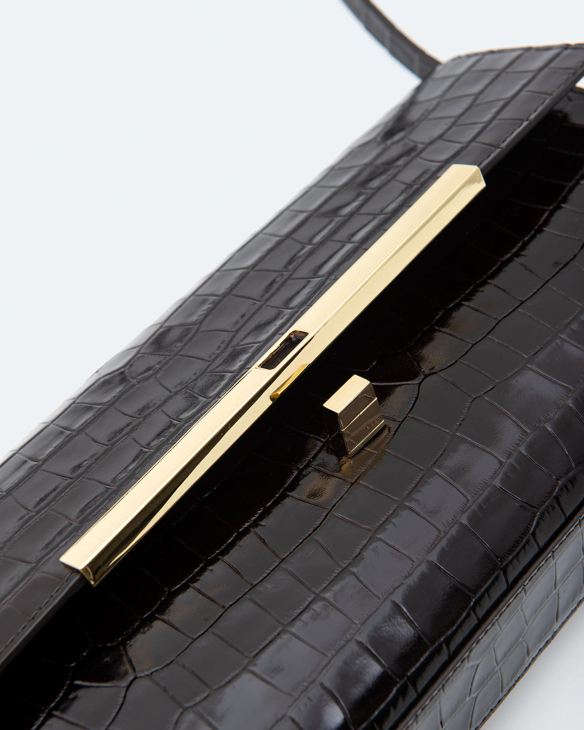 CLUTCH BAG IN PELLE EFFETTO COCCODRILLO